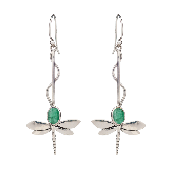 The Willow Earrings by Gallardo & Blaine Designs feature silver dragonflies with green oval gemstones as bodies, intricately detailed wings and tails, and elegant hook-style ear wires. Nature-inspired design—available in various gemstones.
