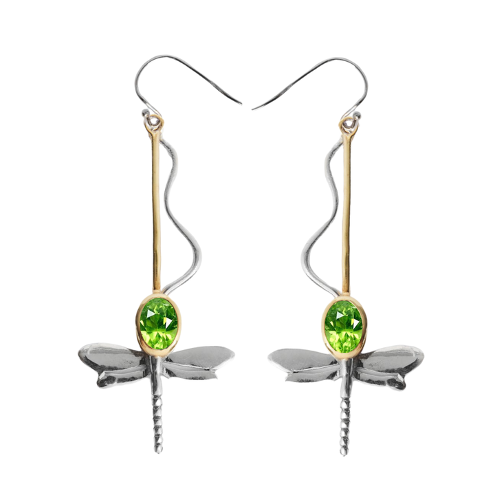 The Willow Earrings by Gallardo & Blaine Designs feature silver dragonfly dangles with gold accents and green oval gemstones, long hooks, and delicate wavy details.