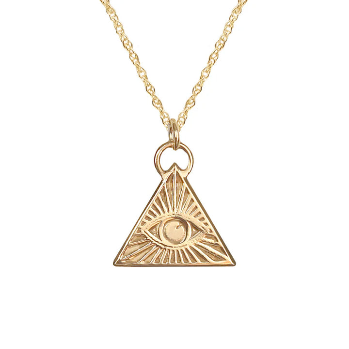 The Little Eye of Protection Necklace Gold by Andrea Mears Jewellery features a gold plated triangle pendant engraved with an eye at the center and radiating lines, inspired by the protective Eye of Protection symbol.