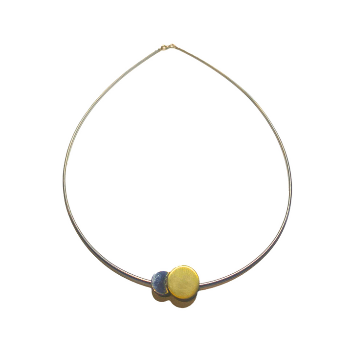 The Gallardo & Blaine Designs Archeol Necklace in Sterling Silver & Gold Vermeil features a minimalist thin metallic band with two round pendants—one gold vermeil, one blue—placed side by side at the center on a plain white background.