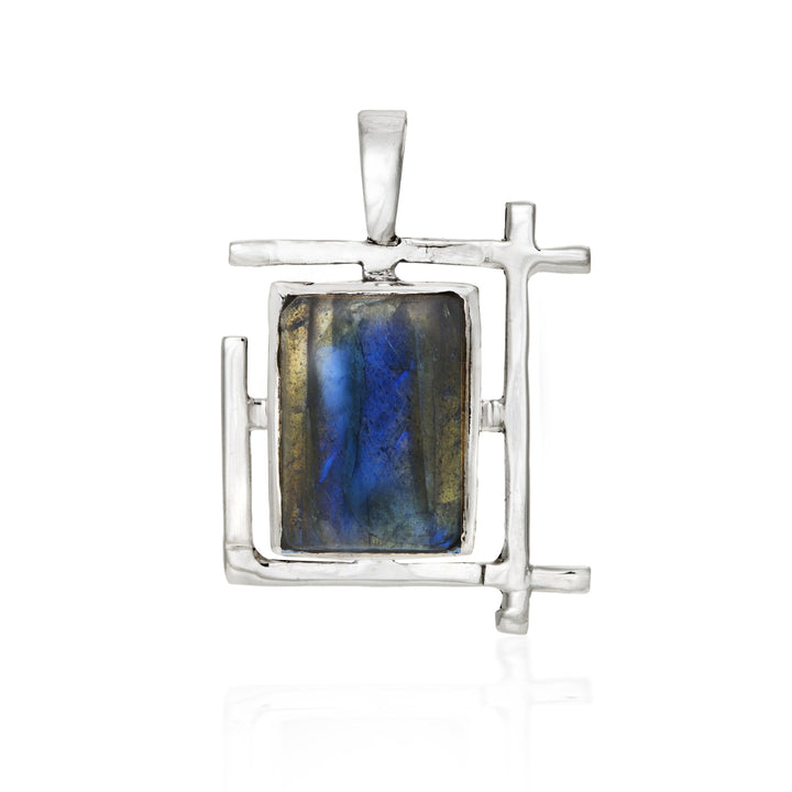 The Gallardo & Blaine Designs Art Deco Pendant features a rectangular blue-green labradorite gemstone set in a modern sterling silver design with intersecting lines, shown on a white background.