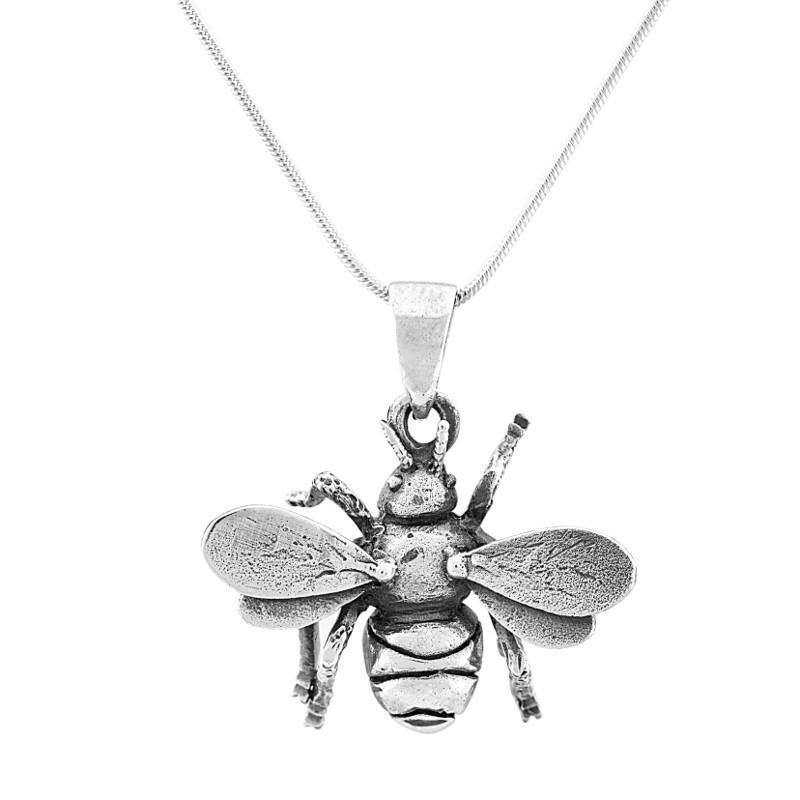 A close-up image of a sterling silver necklace featuring a detailed bee pendant. The pendant captures the bee with textured wings, body, and legs. The Gallardo & Blaine Designs Wildlife Pendant - Small Bee With Chain has a thin, elegant chain. The background is white, highlighting the pendant's intricate design.