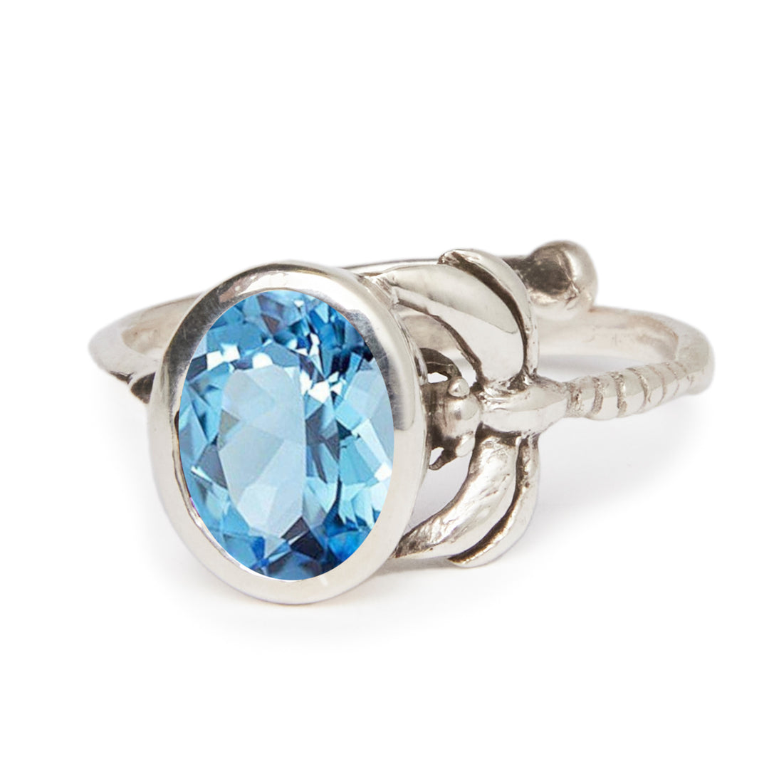 The Daydream Ring by Gallardo & Blaine Designs is a sterling silver gold-plated adjustable ring with an ornate band, featuring a large oval-cut gemstone in your choice of various colors.