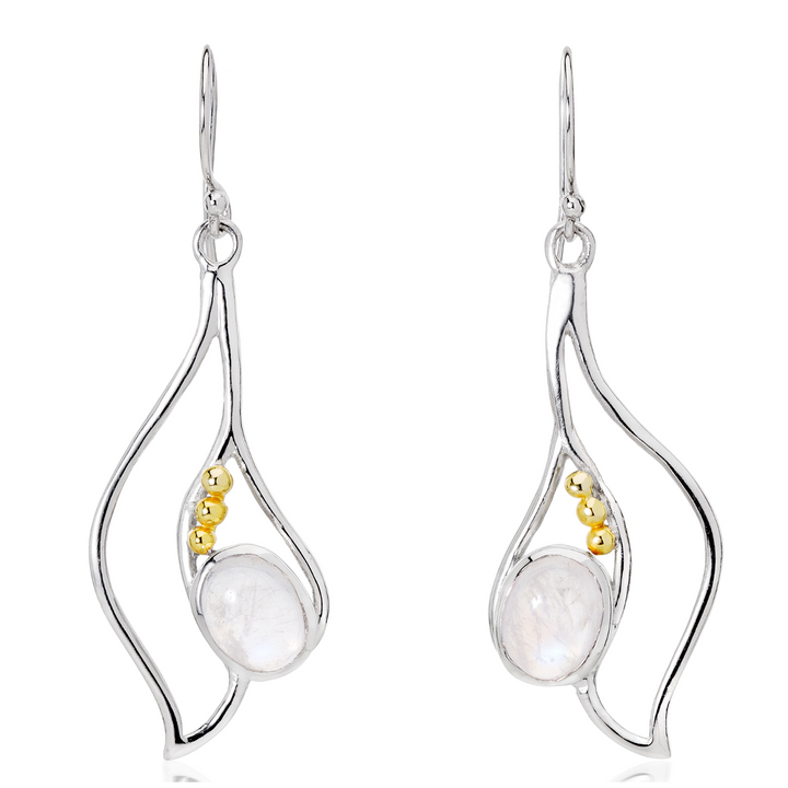 Introducing the Iris Earrings in various gemstones by Gallardo & Blaine Designs: A pair of elegant silver & gold gemstone earrings featuring an abstract, wavy design. Each earring showcases a central pearly white stone adorned with three small gold beads running alongside it. The earrings have a hook fastening for graceful wear.