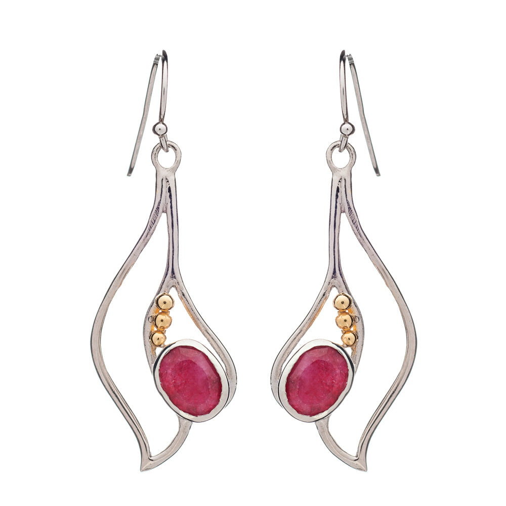 Introducing the Iris Earrings in various gemstones by Gallardo & Blaine Designs: elegant dangle earrings showcasing silver frames with fluid, wavy designs. Each earring is adorned with a pink oval gemstone and three small gold-colored beads. These exquisite gemstone earrings feature fish hook backings for easy wear.