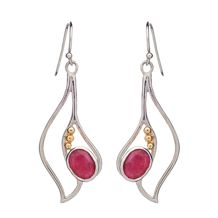 Introducing the Iris Earrings in various gemstones by Gallardo & Blaine Designs: elegant dangle earrings showcasing silver frames with fluid, wavy designs. Each earring is adorned with a pink oval gemstone and three small gold-colored beads. These exquisite gemstone earrings feature fish hook backings for easy wear.