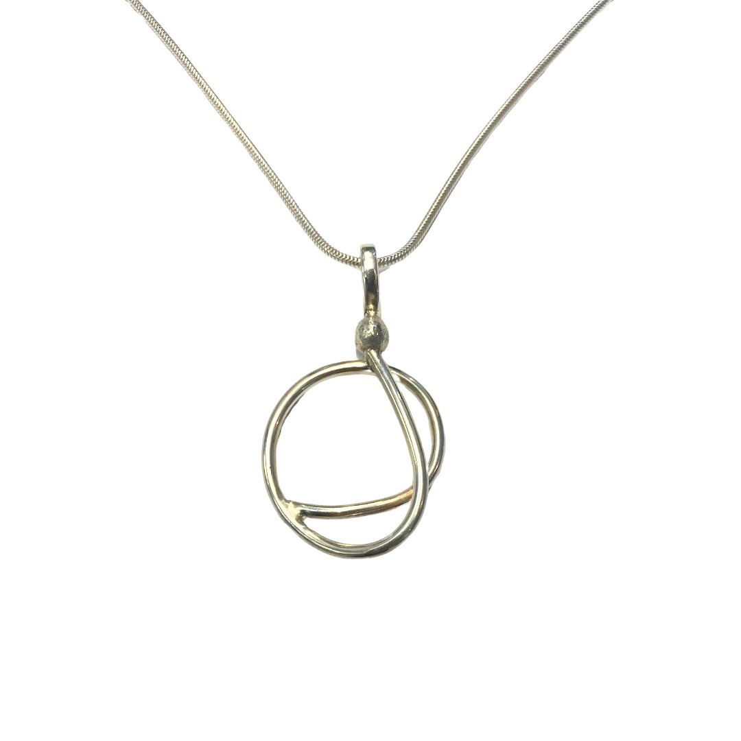 The Sea Honey Necklace by Gallardo & Blaine Designs features an abstract open circle pendant with overlapping curves in sterling silver, suspended from a slender chain. Shown against a white background.
