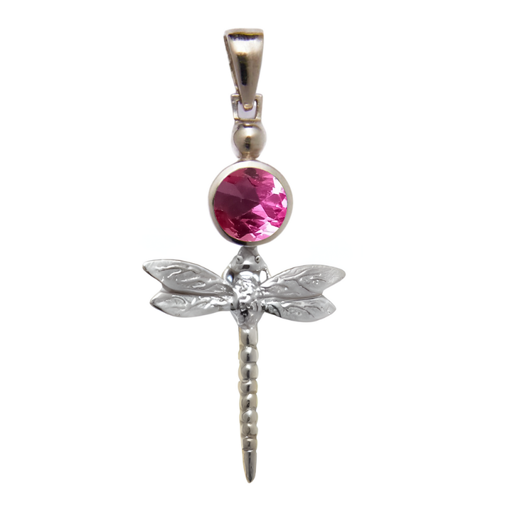 The Damsel Pendant by Gallardo & Blaine Designs features a sterling silver dragonfly with detailed wings and a long tail, accented by a round faceted pink gemstone and suspended from a simple metal bail.
