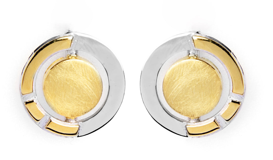 The Urú Studs by Gallardo & Blaine Designs feature a modern, geometric design with gold centers and sterling silver outer rings, accented by fine silver lines—an elegant nod to classic Irish jewelry.