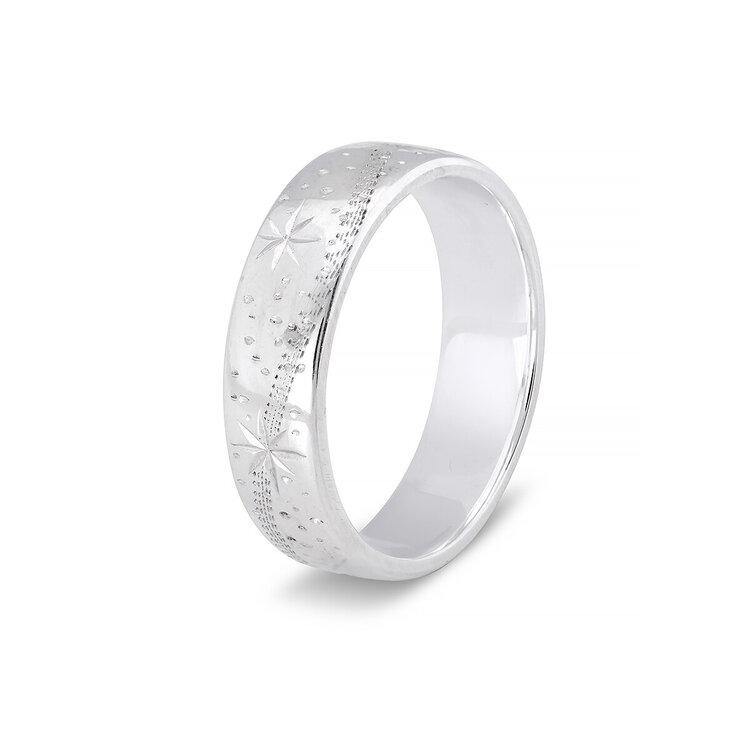 A Shooting Star Silver Wide Ring from Cosmic Boulevard with a subtle shine. The ring features intricate engravings of shooting stars and small dotted textures around the band, giving it an elegant and unique design that symbolizes good luck.