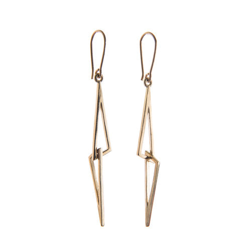 A pair of Le Cheile Drop Earrings 9ct Yellow Gold featuring a zigzag lightning bolt design, crafted from thin 9ct yellow gold. The earrings are minimalist and modern, with a handmade earring hook at the top for easy wear by Miriam Wade.