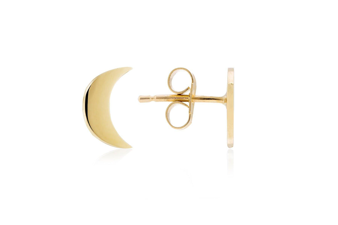 A close-up shot of a single Cosmic Boulevard 9ct Gold Moon & Moon Stud Earring (Yellow Gold version) shaped like a crescent moon. The earring's push-back closure is visible, lying flat against a white background. The sleek design of the crescent moon is simple and polished.
