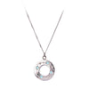 Introducing the "Something Blue" Shooting Star Pendant from Cosmic Boulevard. This exquisite necklace features a circular pendant intricately engraved with patterns and adorned with blue topaz gemstones, reminiscent of shooting stars. The delicate chain enhances the subtle elegance of this silver piece, making it a perfect accessory for sky lovers.
