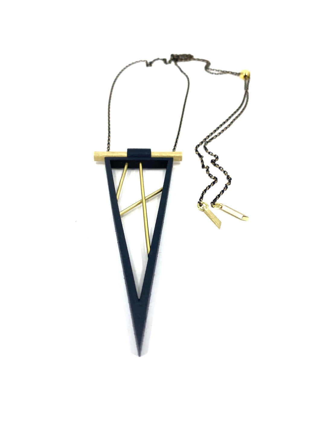 The Elsiem Rapture Spear Long Chain Necklace features a geometric black triangular frame, gold cylindrical bar, and two diagonal rods, all on a slim dark chain—a striking 3D printed piece for contemporary style.