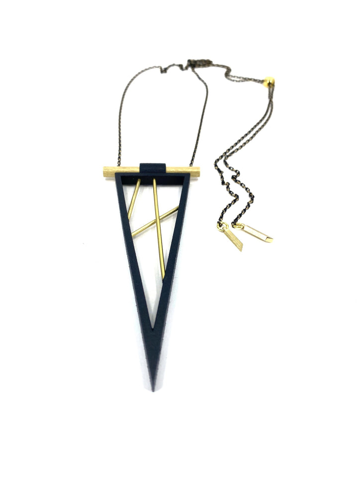 The Elsiem Rapture Spear Long Chain Necklace features a geometric black triangular frame, gold cylindrical bar, and two diagonal rods, all on a slim dark chain—a striking 3D printed piece for contemporary style.
