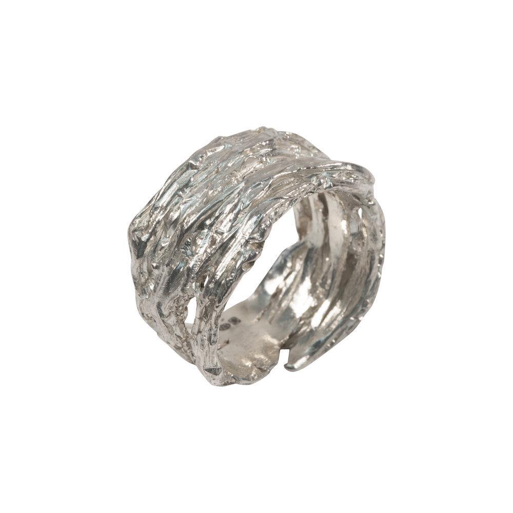 A wide, textural sterling silver Molten Ring Silver by Abbie Dixon with an organic, uneven surface design. The ring appears to have a rugged, handmade aesthetic. The band is thick and open-ended. The entire ring boasts a shiny, metallic finish.