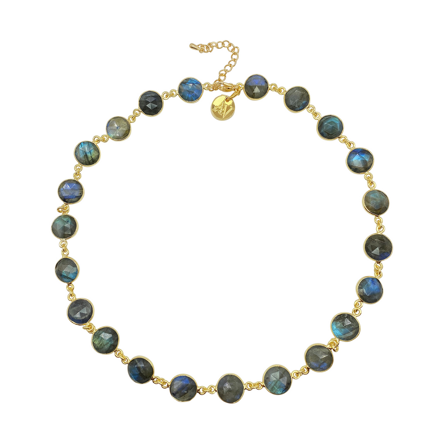 A handmade Aria V Aurora Necklace featuring round labradorite gemstones, each set in a gold bezel and linked together. The necklace has an adjustable gold chain with a small charm near the clasp. The iridescent labradorite stones shimmer in shades of blue, green, and grey.