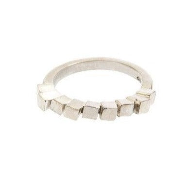 The **Miriam Wade Fusion Stepped Ring Silver** features a unique design with multiple small, square-shaped segments arranged along the band. The squares create a textured, brick structure pattern ring. The ring is displayed against a plain white background.