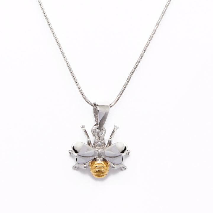 A Gallardo & Blaine Designs Wildlife Pendant - Small Bee With Chain features a bee pendant with intricate silver wings and legs, complemented by a gold-plated, textured body. The delicate chain enhances the pendant's detailed design against a plain white background.