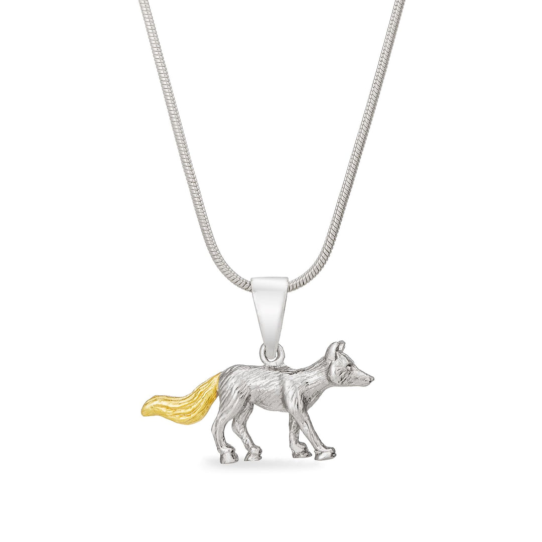 A Wildlife Pendant - Fox With Chain by Gallardo & Blaine Designs. The detailed pendant showcases a gold plated tail, adding a touch of elegance. The simple and elegant chain perfectly complements the intricate design of the fox.