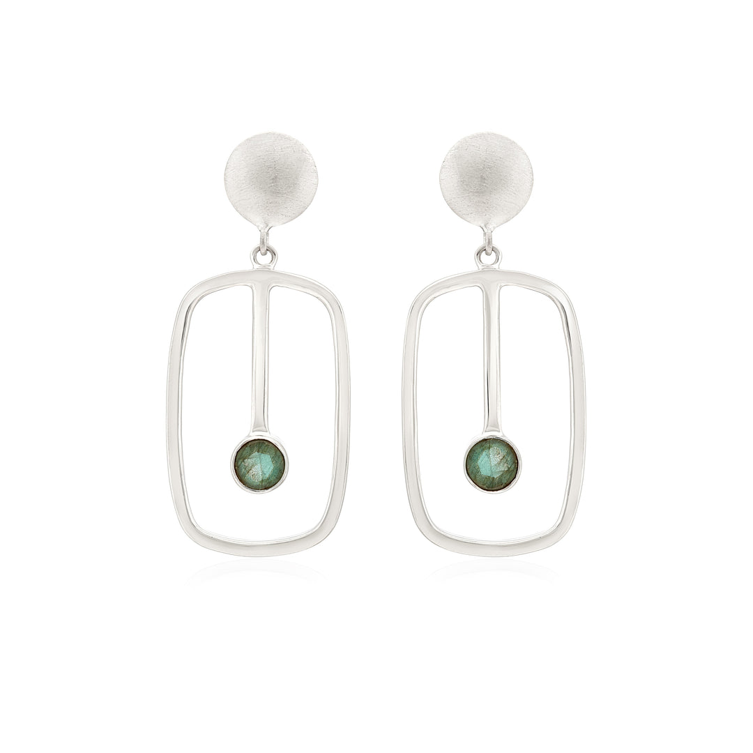 A pair of silver Lorelei Earrings Small in various gemstones by Gallardo & Blaine Designs featuring an oval-shaped design with a small green stone encased at the bottom center of each earring. The design has a modern, minimalist aesthetic.