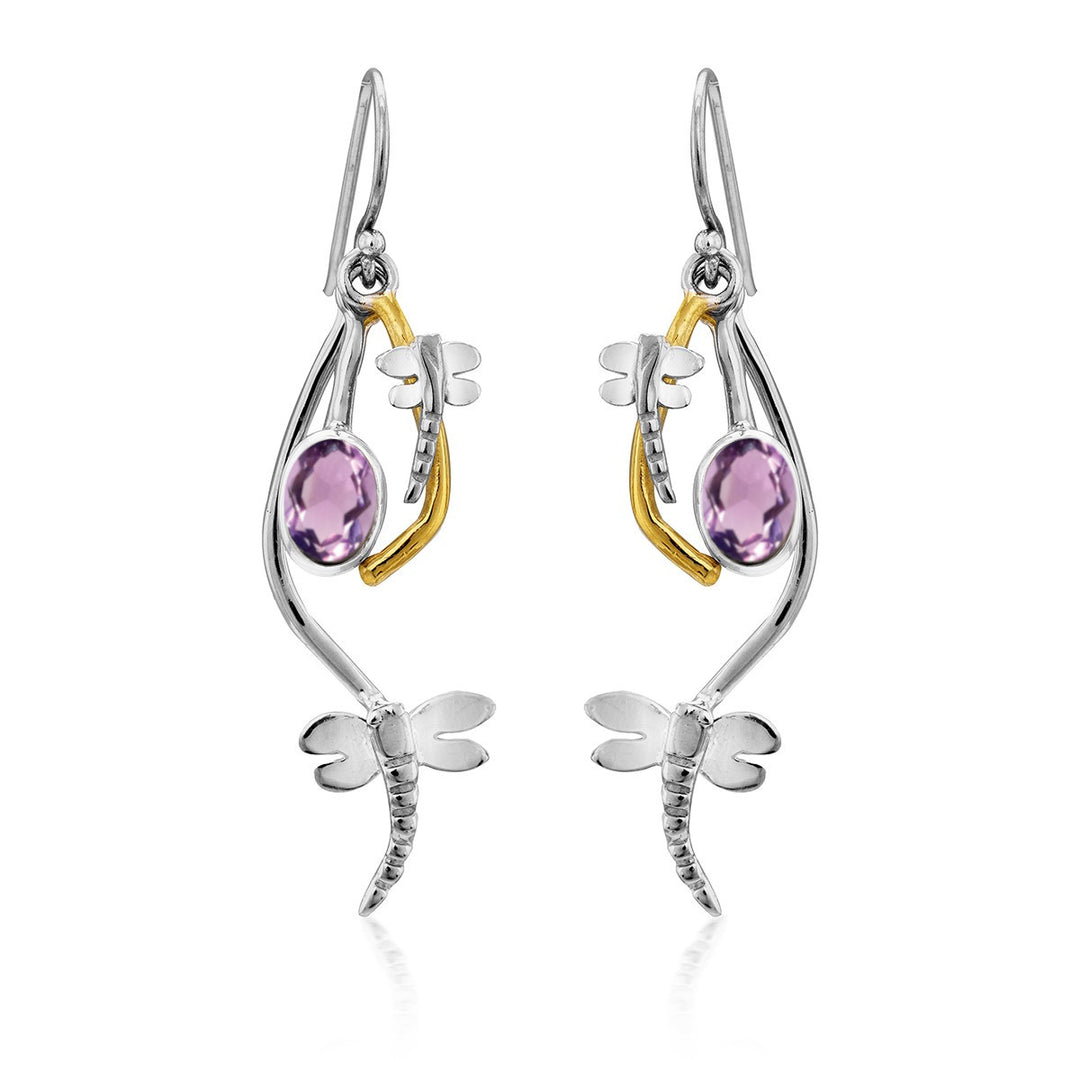 A pair of Ripple Earrings in various gemstones by Gallardo & Blaine Designs. Each earring features a round purple gemstone and intricate dragonfly details with gold-plated bodies and silver wings, beautifully combining polished silver and gold accents.