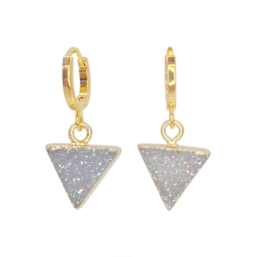 A pair of Aria V Dune Earrings featuring 14k gold-plated brass hoops with dangling triangular pendants encrusted with sparkly, iridescent crystals. The shiny finish enhances the beauty of these stunning earrings, shown against a plain white background.