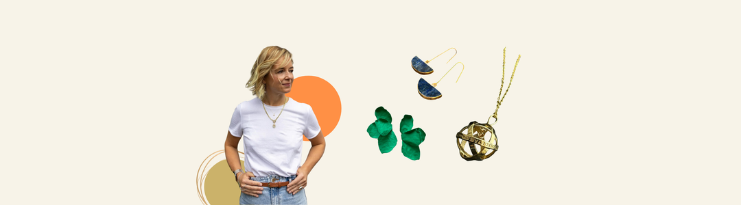 A woman wearing layered necklaces and a white T-shirt stands with her hand in her pocket. Text describes Kybalion Jewellery, an Irish brand making unique handmade pieces inspired by individuality and self-mastery.