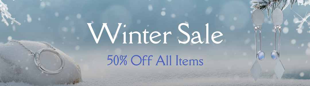 Winter Sale banner with rings and earrings on a frosty, snow-covered background. Text reads: "Winter Sale. Up to 20% off selected pieces.