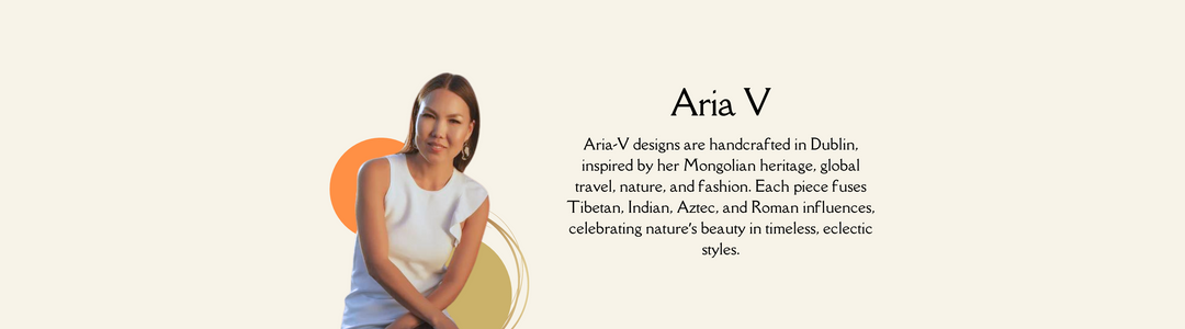 A woman with long hair sits in a sleeveless white dress. The text reads: "Aria V designs are handcrafted in Dublin, inspired by her Mongolian heritage, global travel, nature, and fashion. Each piece fuses Tibetan, Indian, Aztec, and Roman influences.