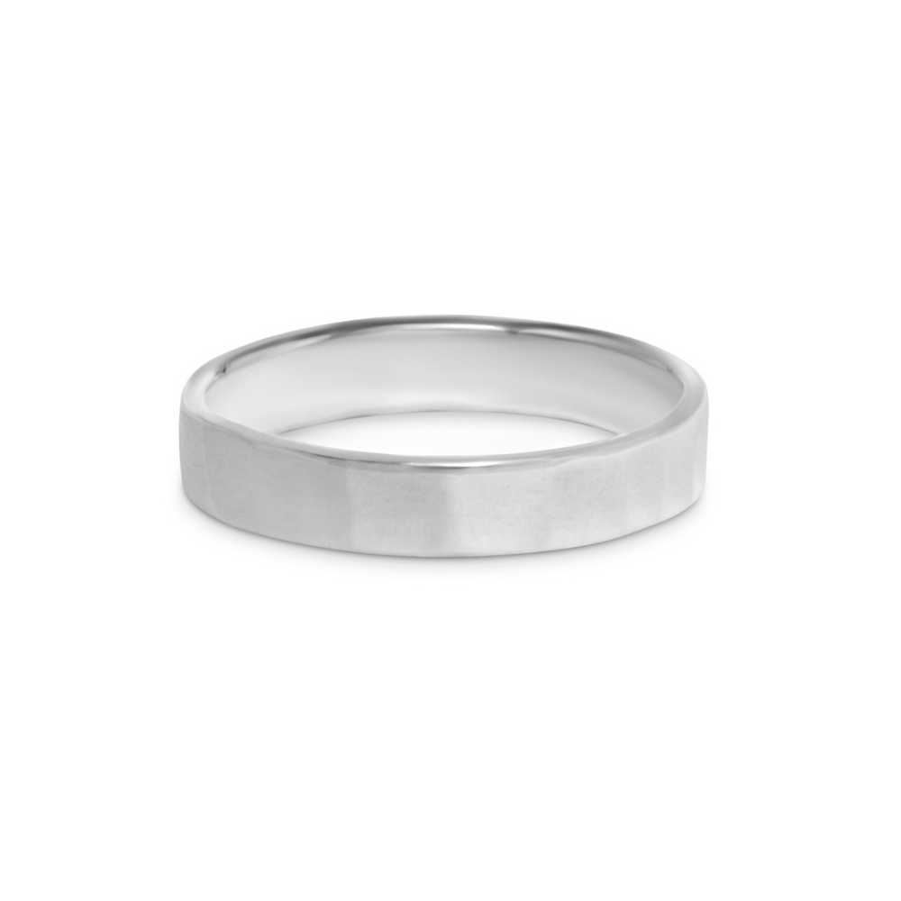 The Collective Dublin 4mm Flat Hammer Texture Ring features a handmade, polished silver band with a flat hammered surface, shown on a white background.