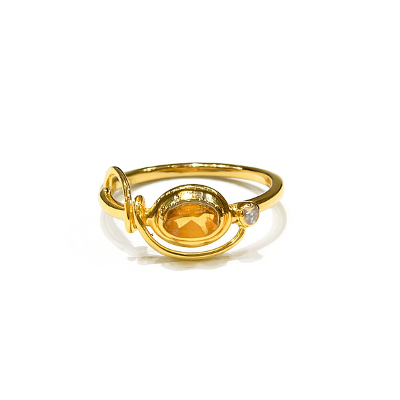 The Watermelon tropical Citrine & Cubic Zirconia Gold Ring features a gold-plated sterling silver band with an oval citrine center and a clear cubic zirconia accent, designed like a planetary orbit. Shown on a white background.