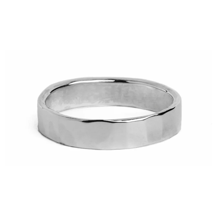Flat Stering Silver 5mm wide ring with a flat hammered texture on the outside of the band.