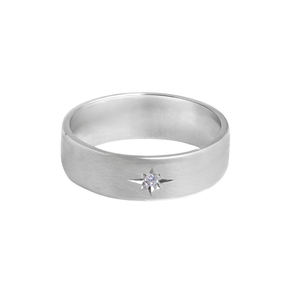 The Collective Dublin's 6mm Wedding Ring features a matte finish and a star-set lab grown diamond at the center, combining modern elegance with sustainable style.