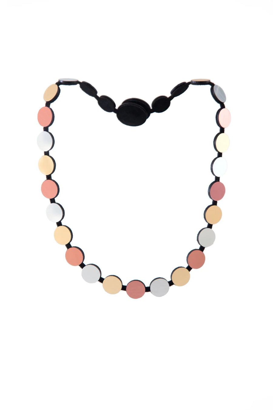 The Abstraction Silver, Gold & Rose Gold Necklace by Iskin Sisters, featuring a pattern of flat, round beads in shades of pink, beige, white, and black arranged along a black string, is perfect for gift packaging.