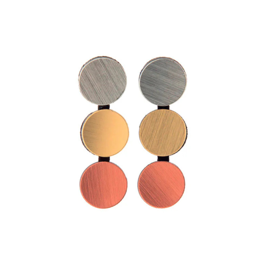 Three pairs of Abstraction 3 Dots Earrings by Iskin Sisters, in silver, gold, and copper finishes, are arranged vertically against a white background for a refined touch.