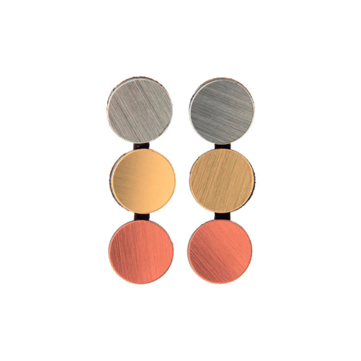 Three pairs of Abstraction 3 Dots Earrings by Iskin Sisters, in silver, gold, and copper finishes, are arranged vertically against a white background for a refined touch.