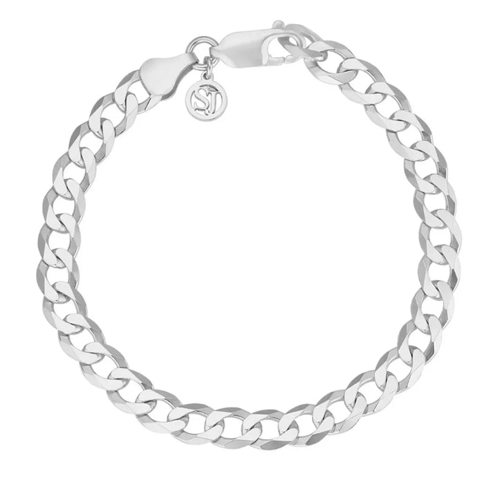 The Sif Jacobs Armore Bracelet is crafted from 925 Sterling silver with flat interlocking curb links, a lobster clasp, and a small round charm engraved with the brand logo for timeless elegance.