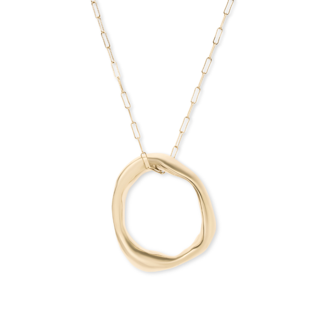 The Bough Necklace by Madeleine Sculptural Jewellery features a delicate gold chain and a large, smooth, organically shaped circular pendant—an elegant piece of organic jewellery.