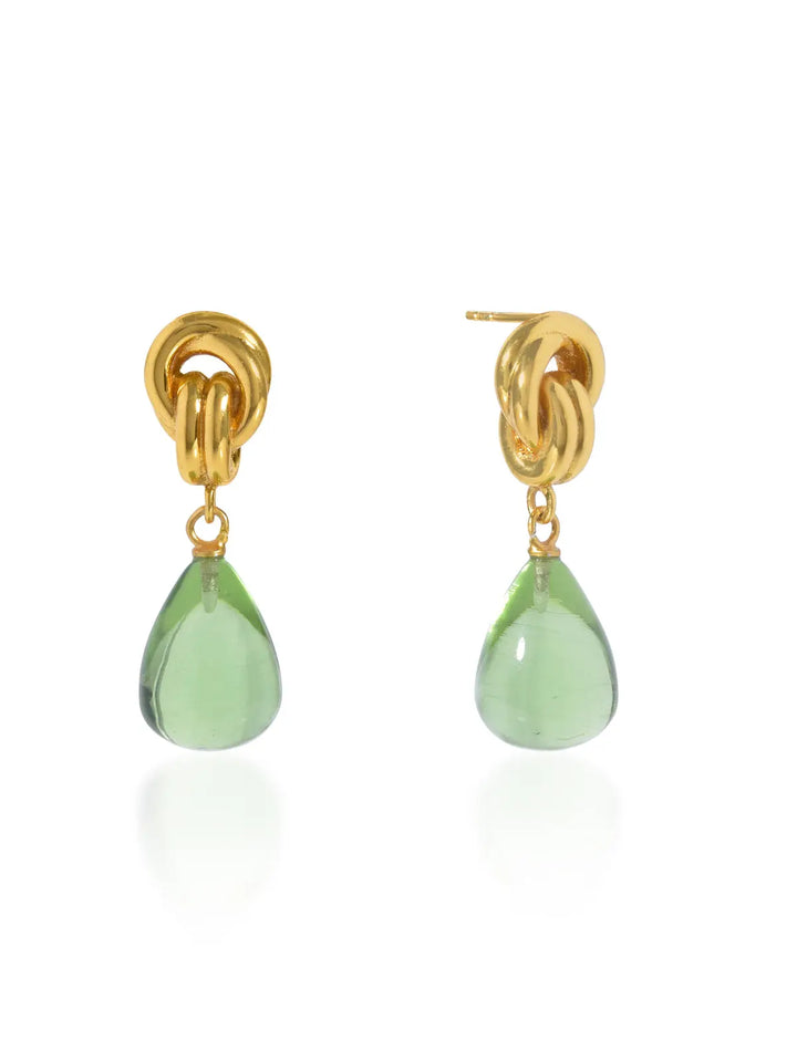 Shyla’s Chunky Knot Earrings in gold-over-silver feature a bold knot stud and dangling teardrop-shaped green gemstones, shown on a white background. Hypoallergenic and stylish, these earrings blend comfort with everyday elegance.