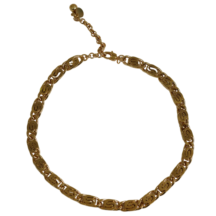 The Caesar Chain Gold Scroll Chunky Necklace by Zubeldia features gold-plated oval links and a small adjustable extension chain ending in a round bead.