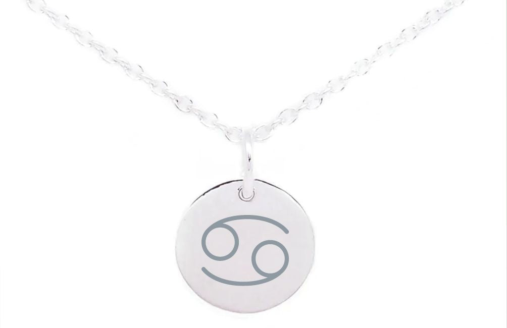 A silver necklace features a round pendant engraved with the Cancer zodiac sign, consisting of two intertwined figures resembling the number 6 and 9. The chain is delicate with a simple, elegant design. Complement your style with Horoscope Large Disc Charm Silver from Personalised Charms representing horoscope symbols on a plain white background.