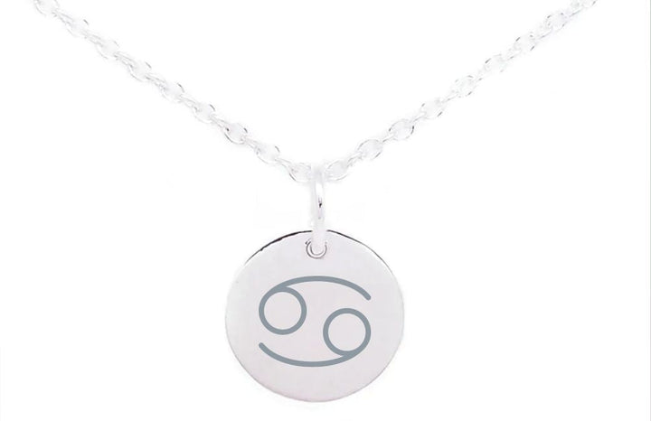 A silver necklace features a round pendant engraved with the Cancer zodiac sign, consisting of two intertwined figures resembling the number 6 and 9. The chain is delicate with a simple, elegant design. Complement your style with Horoscope Large Disc Charm Silver from Personalised Charms representing horoscope symbols on a plain white background.