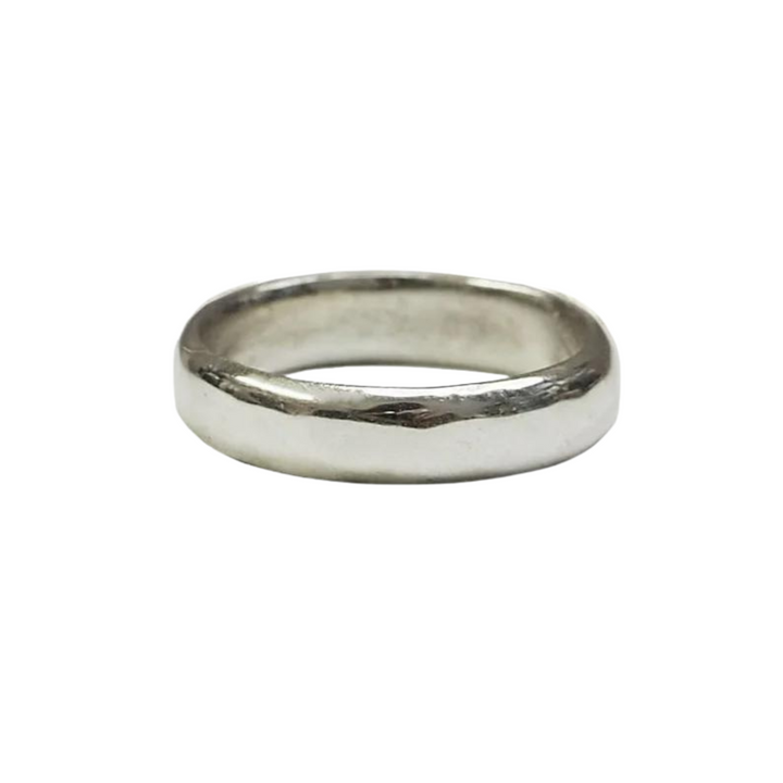 A simple, polished silver band ring with a smooth, slightly rounded surface. This classic wedding ring features a timeless design with no additional engraving. The Classic 4mm Wedding Band from The Collective Dublin is displayed against a plain white background.