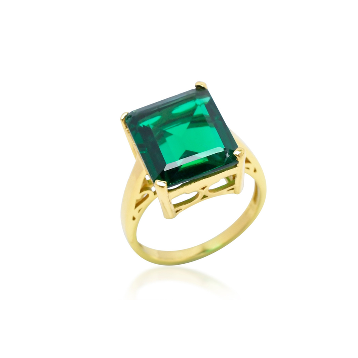 The Claudia Ring by Shyla features a large rectangular green gemstone in a raised prong setting on gold-plated sterling silver, shown against a white background.
