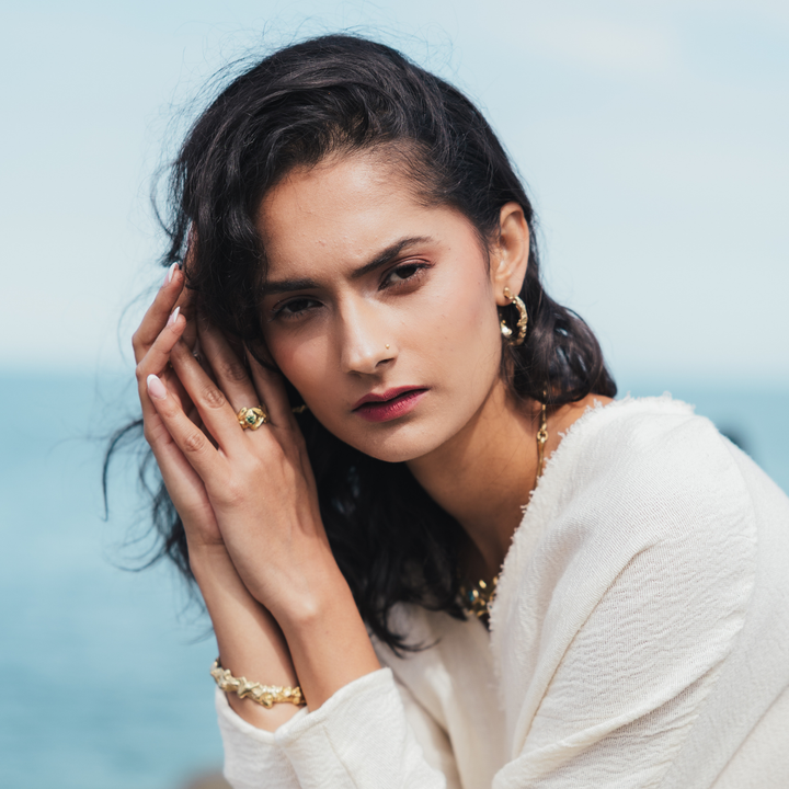 Molten Hoops in various sizes, hand-carved brass and precious metal earrings inspired by fluid geological forms and transformation. Available in brass, silver, gold plated brass, and 9 carat gold.
