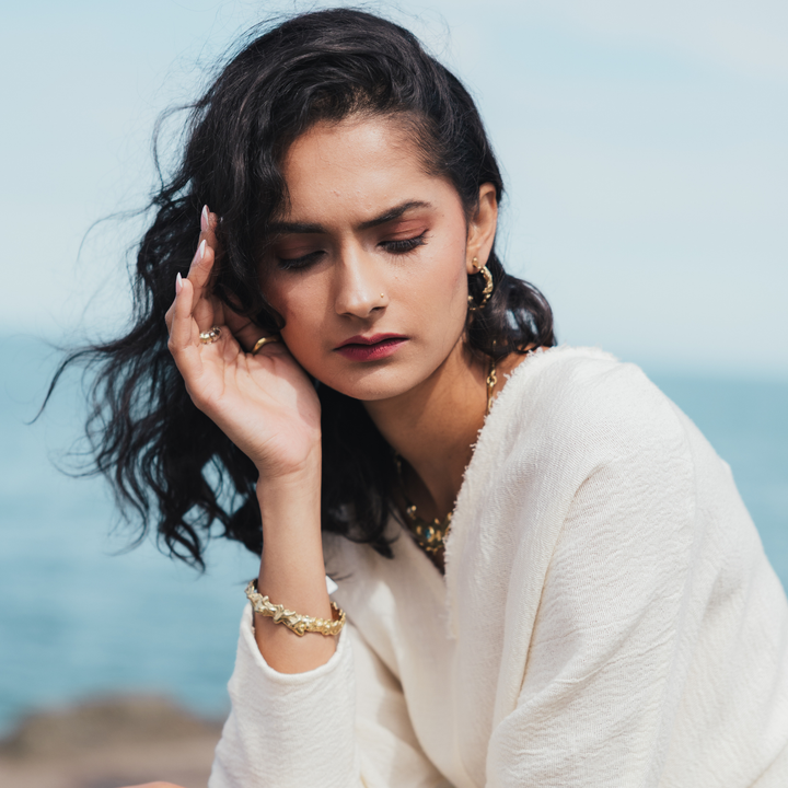 Molten Cuff Small: brass, silver, or 9 carat gold cuff bracelet inspired by the earth's core, symbolizing constant evolution and transformation.

