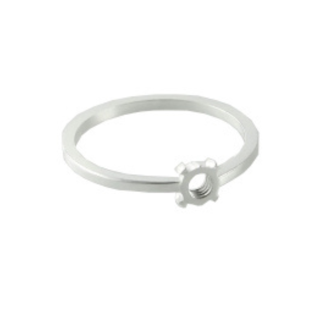The Fruit Bijoux Minimal Ring Silver by Fruit Bijoux is a delicate sterling silver ring featuring a small gear-shaped ornament on its slim, circular band. The gear adds a unique, industrial touch to the minimalist design. The ring's brushed finish enhances its subtle sheen, making it a subtle yet distinctive accessory in the Fruit Bijoux ring tops collection.