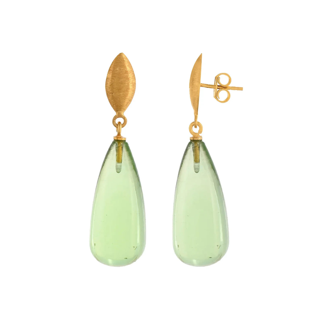 A pair of elegant, hypoallergenic Corine Earrings by Shyla, featuring gold, marquise-shaped tops and translucent, teardrop-shaped green gemstone pendants.