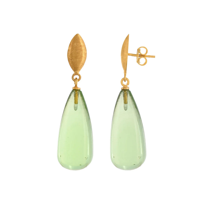 A pair of elegant, hypoallergenic Corine Earrings by Shyla, featuring gold, marquise-shaped tops and translucent, teardrop-shaped green gemstone pendants.